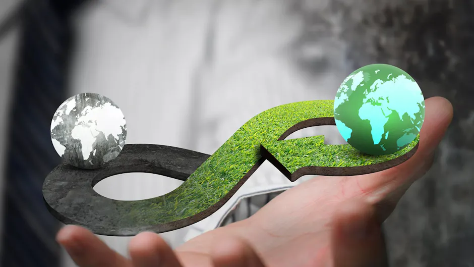 Une forme infinie faite d'herbe, à gauche et à droite un globe terrestre gris et vert