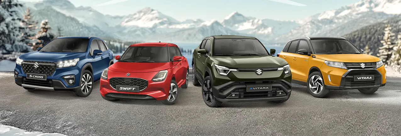 Gamme Suzuki en blanc, avec les Alpes en arrière-plan